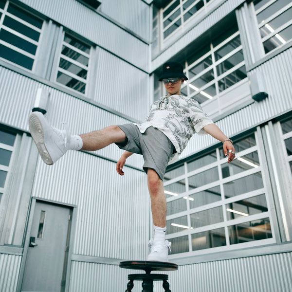 Child balancing on one leg in a tree pose, showing focus.